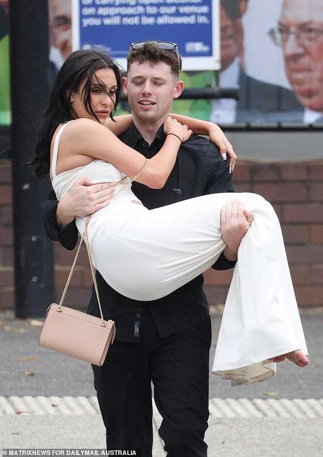 This racegoer looked as if she had been carried across the threshold at Royal Randwick on Saturday.