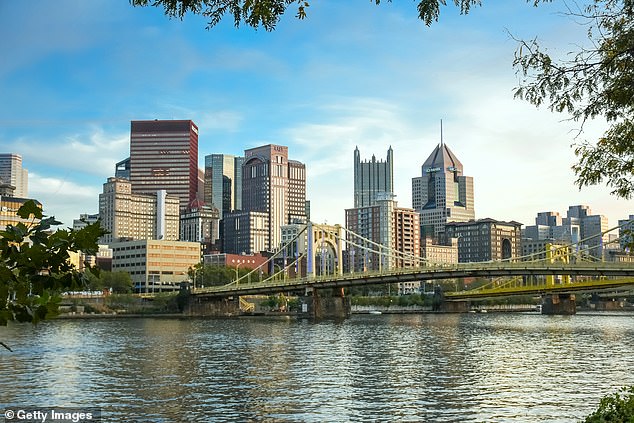 The city also has a thriving arts and culture scene and abundant outdoor adventures, from biking to kayaking at historic Point State Park. (Pictured: Pittsburgh skyline with its famous 'Rachel Carson Bridge', several skyscrapers and the Allegheny River waterfront)