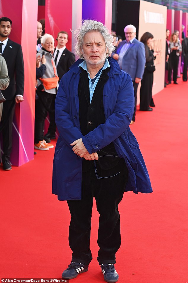 Actor and film director Dexter Fletcher braved the weather in a blue quilted coat