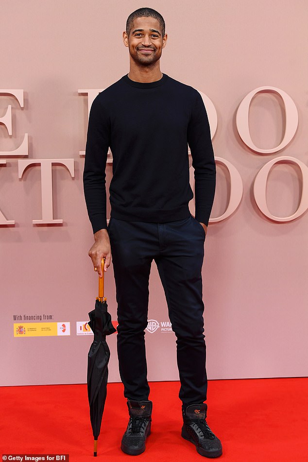 Alfred Enoch looked effortlessly chic in an all-black ensemble