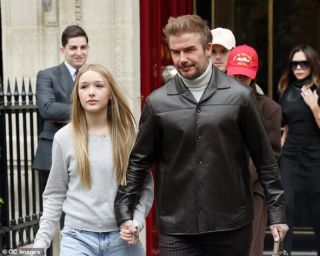 Harper with her father, former footballer David. He likes sports like his father and he also likes ballet.