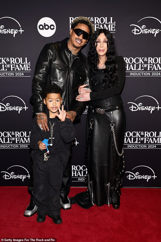 She was joined on the red carpet by her boyfriend, Alexander 'AE' Edwards, and her four-year-old son, Slash Electric Alexander Edwards.