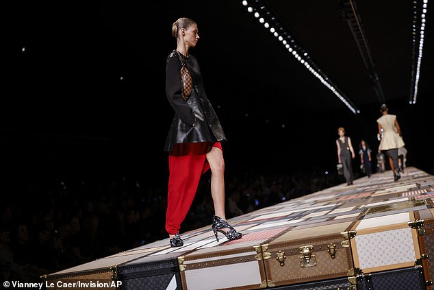 A Louis Vuitton model sported bright red one-leg pants while walking the runway at Paris Fashion Week earlier this month.