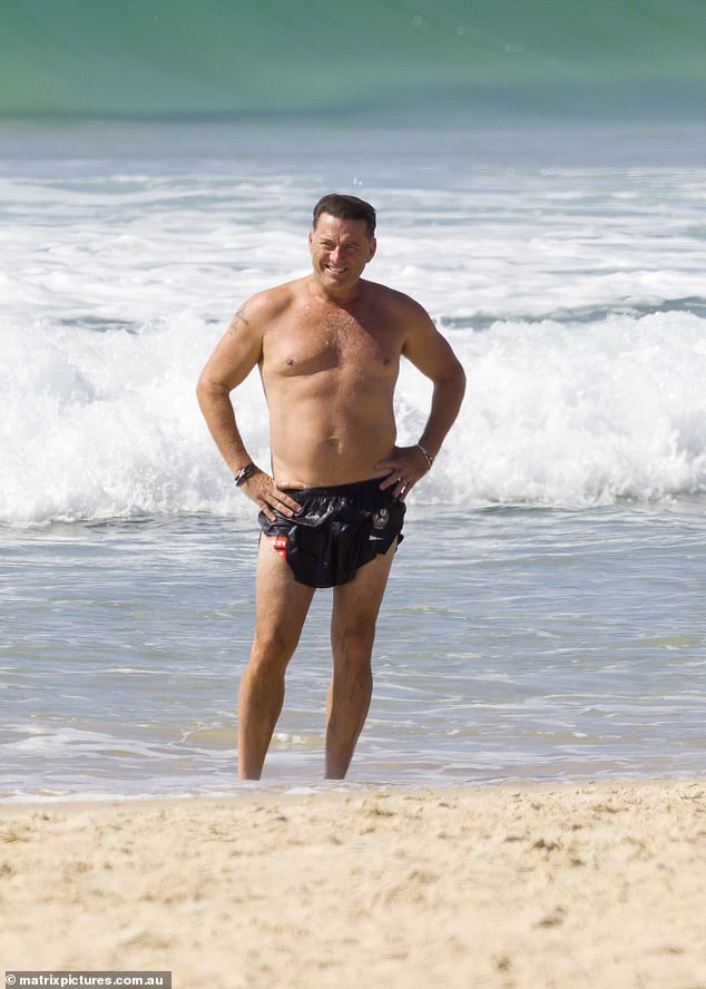 Karl was all smiles in September when he went off air to flaunt his physique on nearby Noosa Beach.