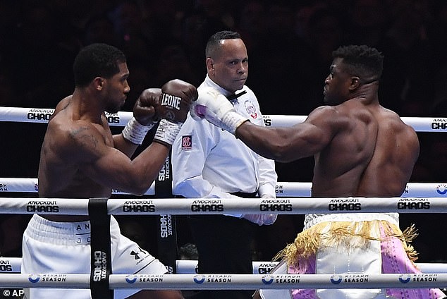 Ngannou was returning to MMA after boxing fights against Anthony Joshua (pictured, left) and Tyson Fury over the past year.