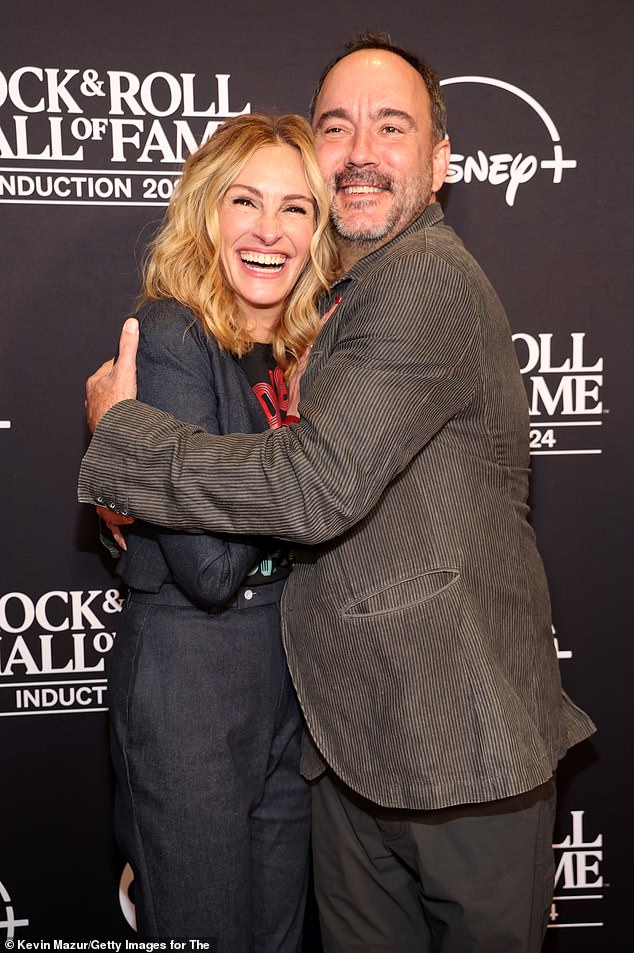 The 56-year-old actress posed with 2024 member Dave Matthews, 57, on the red carpet.