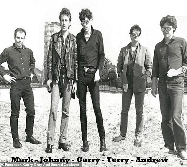 Andrew, pictured right, with band members Garry Gray and Sacred Cowboys, Mark Ferrie, Janis Friedenfelds, Garry Gray and Terry Doolan (LR)