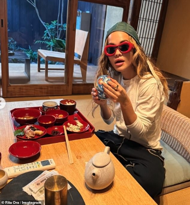 The singer showed off a peculiar figure while enjoying a Japanese meal.