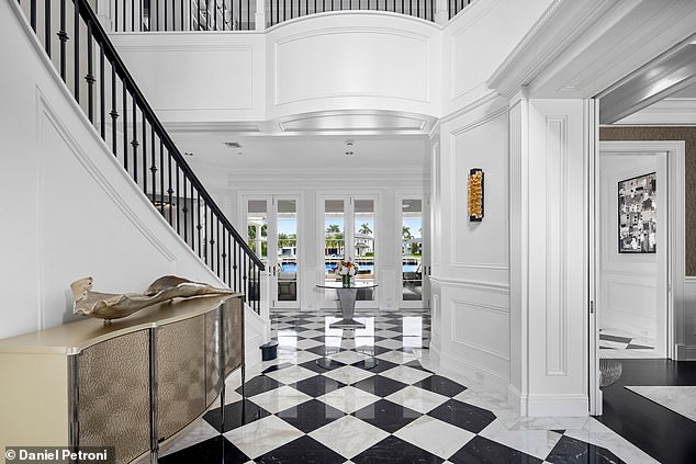 A grand spiral staircase serves as the centerpiece of The Miramar Estate and ascends elegantly to the stairs.