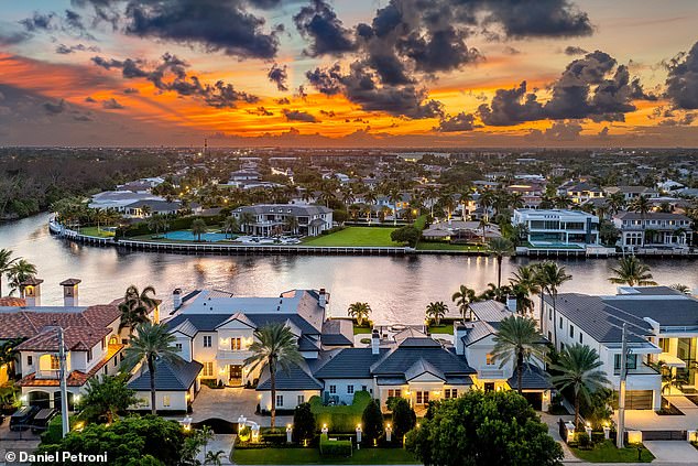 The gentle ripples of the water and lush greenery create a tranquil atmosphere as the home sits on the Intracoastal Waterway.