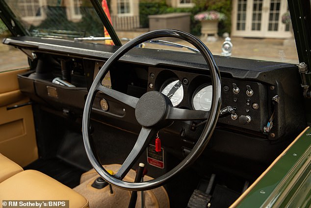 The driver's seat of the open-top green vehicle, which was specially equipped with traffic light buttons so that the late Queen could alert her driver when she wanted to stop and go.