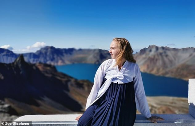 Zoe, seen here in traditional Korean clothing on Paektusan Mountain with Heaven Lake in the background, comments: 