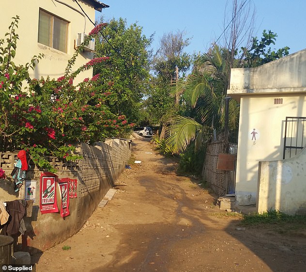 Elly's body was found lying outside this gritty public toilet block near the heart of Tofo.