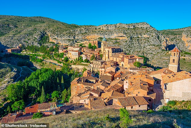 In Albarracín, 'the houses are painted a soft pink, which makes the whole town shine when the sun shines'