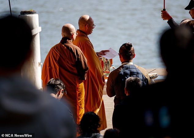 Buddhist monks led prayers and burned incense as the local Vietnamese community rallied around the father.