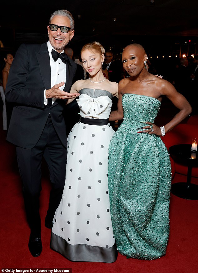 Cynthia recently criticized a particular edited Wicked poster featuring her and co-star Ariana, where the fan had made it look like the original West End post (Both pictured with co-star Jaff Goldblum).