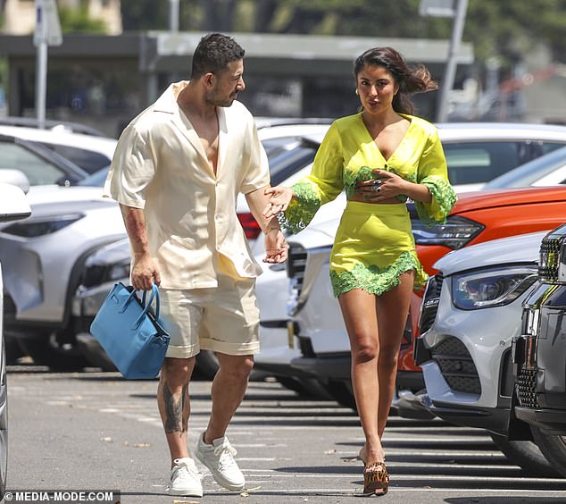 At one point, Jono happily carried the expensive designer item as Nilofar adjusted her blouse before entering the luxurious Catalina restaurant, located on Sydney's Riviera in Rose Bay.