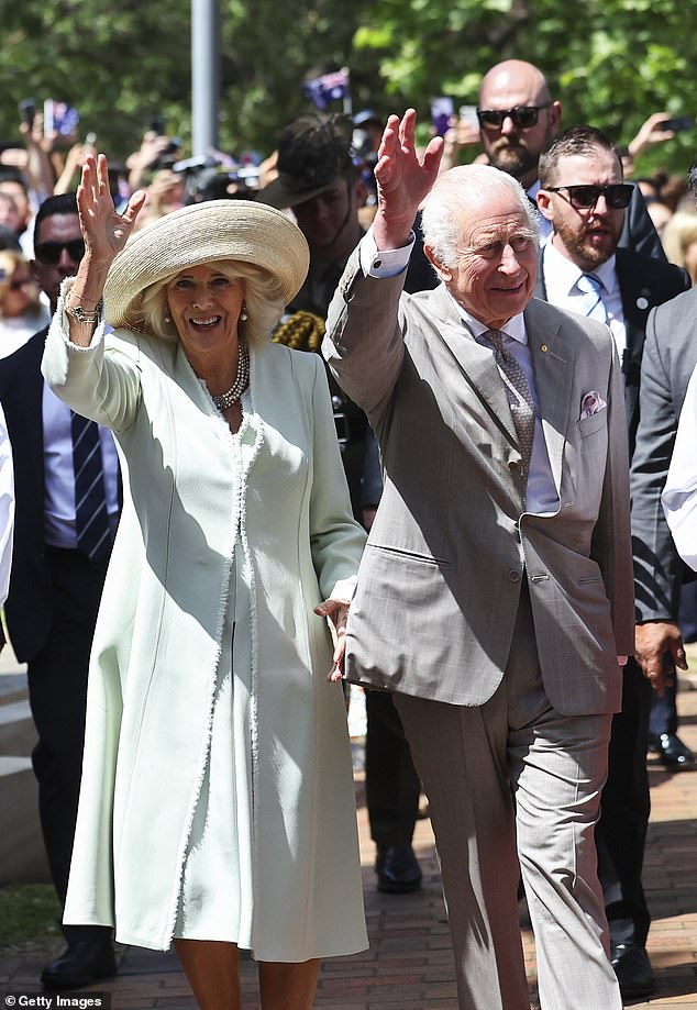 King Charles and Queen Camilla greet the crowd gathered to welcome their arrival in Sydney (pictured)