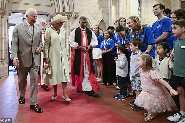 The King and Queen greet young supporters as they enter St. Thomas Church