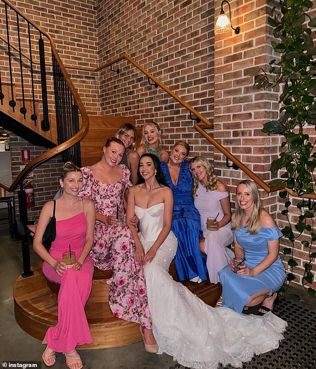 Caitlin, who has built an impressive legal career as a lawyer, stunned in a classic silk wedding dress, with a lace-embellished train adorned with sparkling jewels. Center in the photo