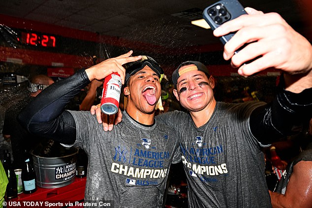 Juan Soto (left) and Anthony Rizzo (right) pose for a selfie with their commemorative t-shirts.