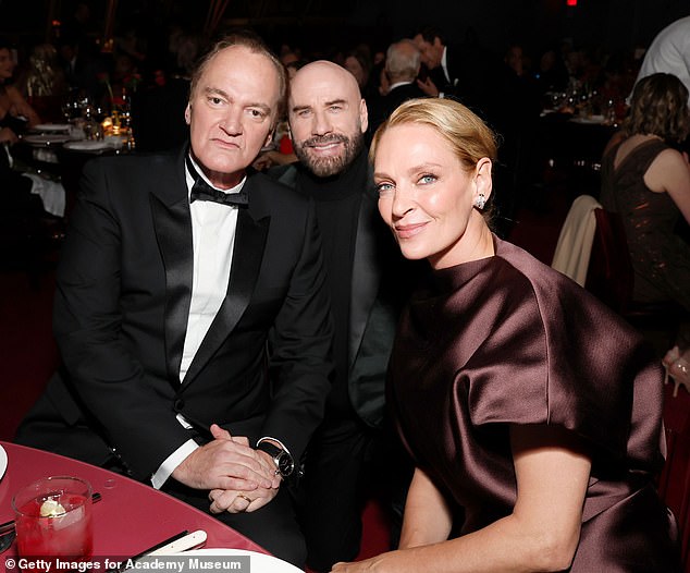 Travolta looked dapper in a black suit jacket paired with a turtleneck sweater for the evening, while Tarantino sported a tuxedo.