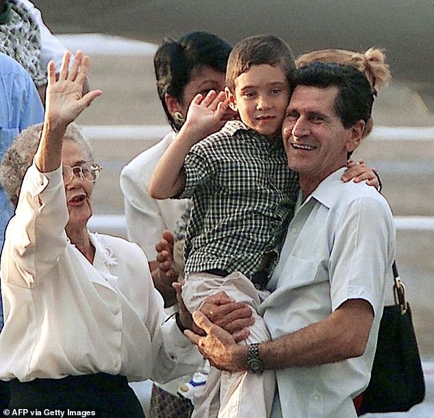 In the photo: Elián González (C), a six-year-old Cuban castaway, is carried by his paternal grandfather Juan González (R) alongside his great-grandmother Ramona (L) upon Elián's arrival from the United States on June 28, 2000 to the José Martí airport in Havana.