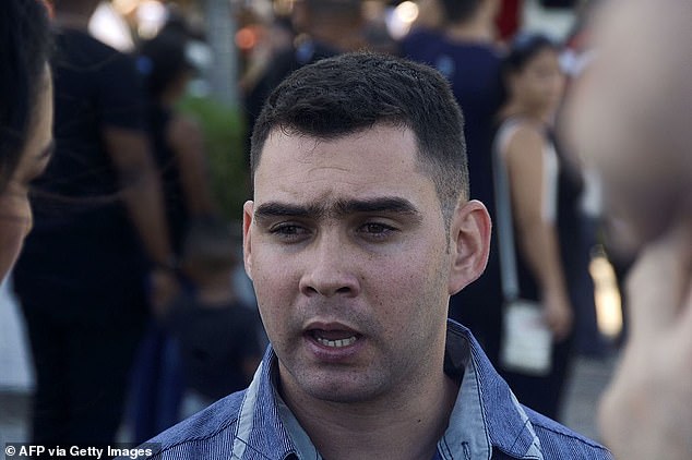 Pictured: Elián González speaks to the press in Havana's Plaza de la Revolución, where people pay their respects to Cuban revolutionary leader Fidel Castro on November 29, 2016.