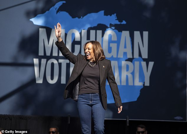 Democratic presidential candidate Vice President Kamala Harris takes the stage to speak at a campaign event on October 18, 2024 in Grand Rapids, Michigan.