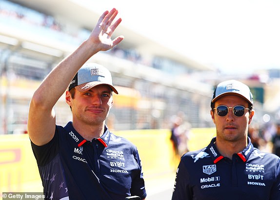 AUSTIN, TEXAS - OCTOBER 20: Max Verstappen of the Netherlands and Oracle Red Bull Racing and Sergio Perez of Mexico and Oracle Red Bull Racing watch from the drivers' parade before the United States F1 Grand Prix at Circuit of the Americas on the 20th October 2024 in Austin, Texas. (Photo by Mark Thompson/Getty Images)