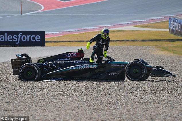 Hamilton, pictured getting out of his car, retired early on an unforgettable day for the Englishman.