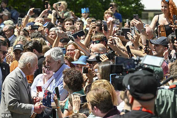 Britain's King Charles greets supporters as they leave St Thomas' Anglican Church in Sydney, Sunday, Oct. 20, 2024. (Dean Lewins/Pool Photo via AP)