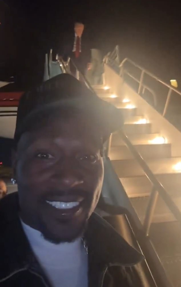 Trump was strangely greeted on the tarmac by former NFL star Antonio Brown after landing.