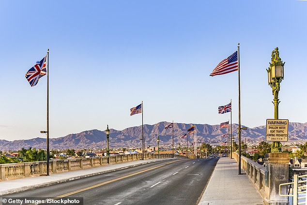 In the photo: The flags of the United States and Great Britain fly over the bridge today.