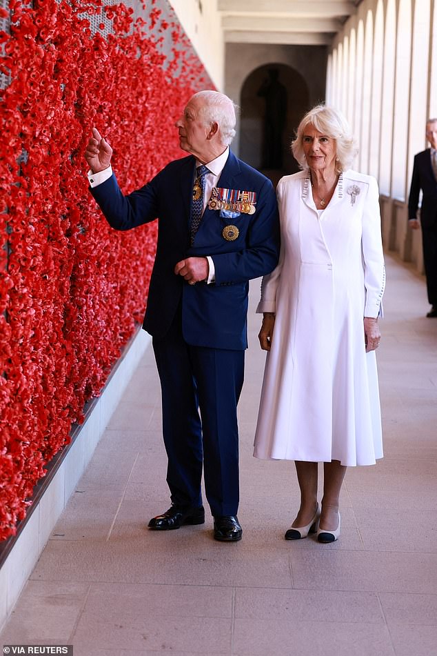 After Charles and Camilla left floral tributes in recognition of the Australian Defense Force troops who paid the ultimate sacrifice, they walked the short distance to the memorial's roll of honour.