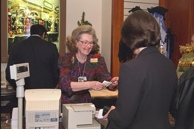 Raine serving a customer at Harrods Heathrow in 1997