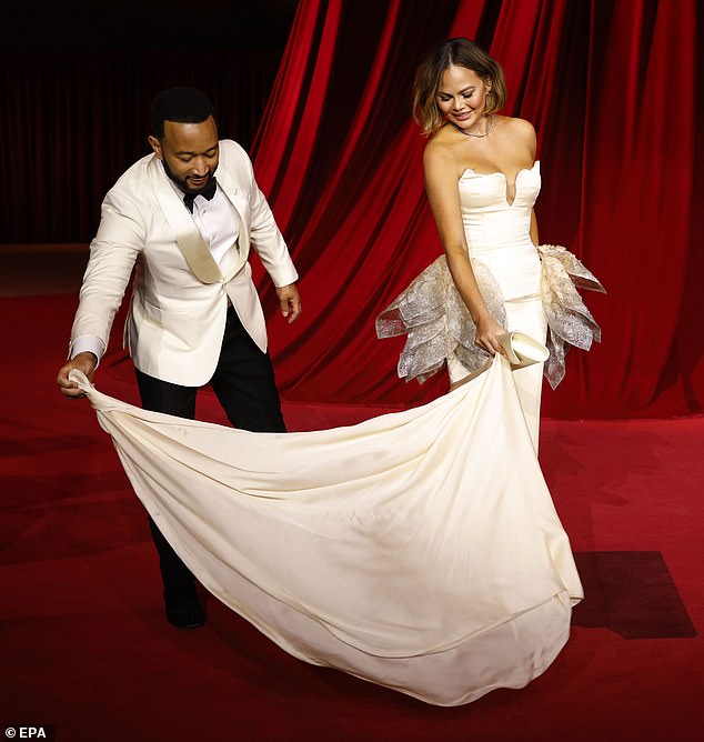 The model, 38, and the Grammy-winning singer, 45, coordinated in chic cream ensembles for their red carpet appearance.