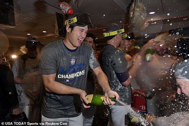 He also returned the favor by popping and spraying some of his own champagne bottles.