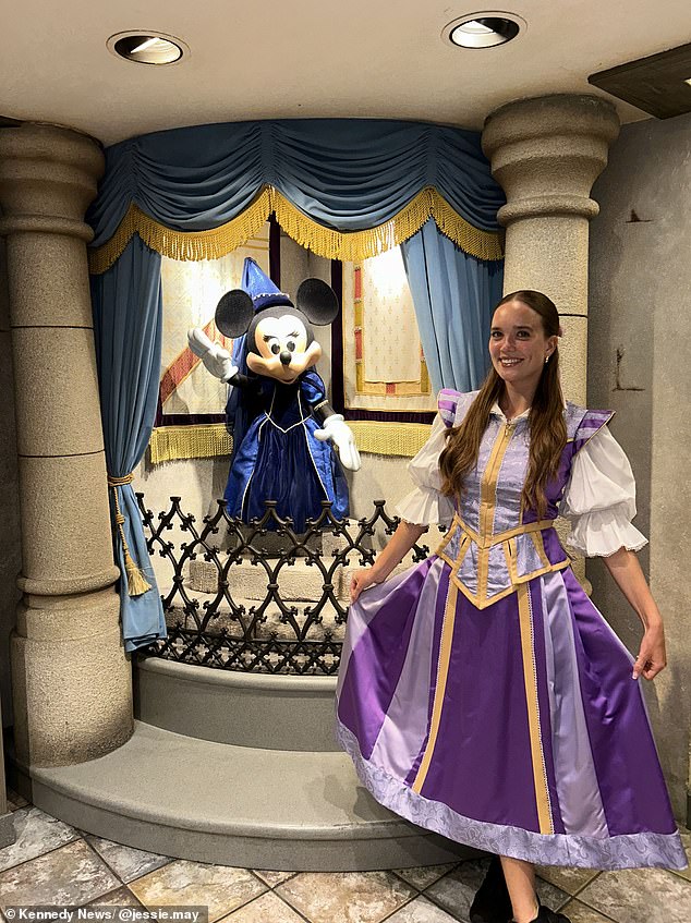 The graduate of Bishop Grosseteste University in Lincoln said she wore her assigned Disney uniform during shifts, but on her days off she created her own themed outfits to wear at the theme parks. She appears in the photo at work.