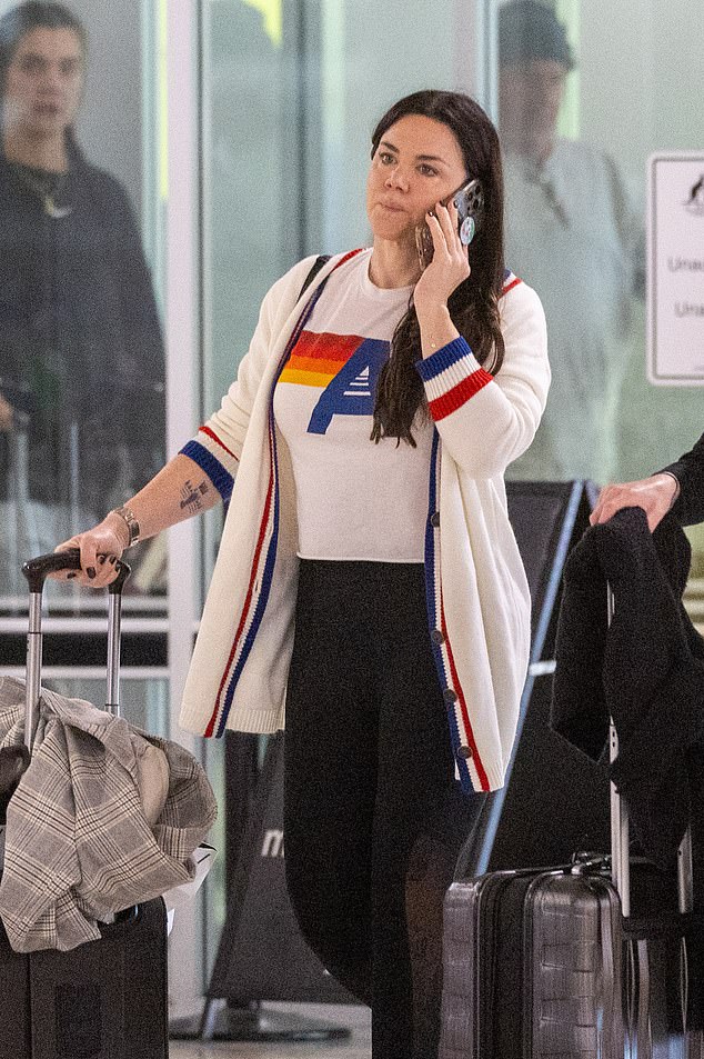 The Australian singer, 43, who recently won a court battle against her mother, looked casual as she arrived at the airport in her hometown.