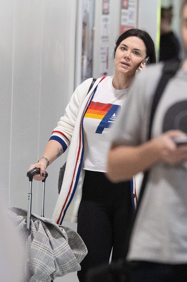 The singer, who moved to the US in 2017, wore her dark hair down and opted for a no-makeup look when she returned to Australia.