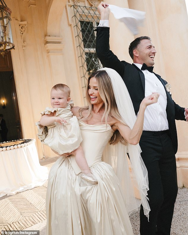 The happy couple were all smiles as they celebrated with their baby boy, Robbie.