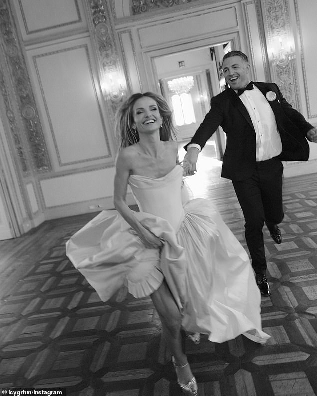 In another image, the newlywed sweethearts are seen running through a cavernous room with abandon, grinning from ear to ear.