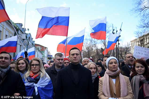 Russian opposition leader Alexei Navalny, his wife Yulia, opposition politician Lyubov Sobol and other protesters march in memory of murdered Kremlin critic Boris Nemtsov in central Moscow on February 29, 2020.