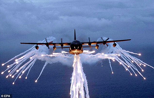 A US AC-130 combat helicopter deploys flares capable of distracting incoming missile threats.