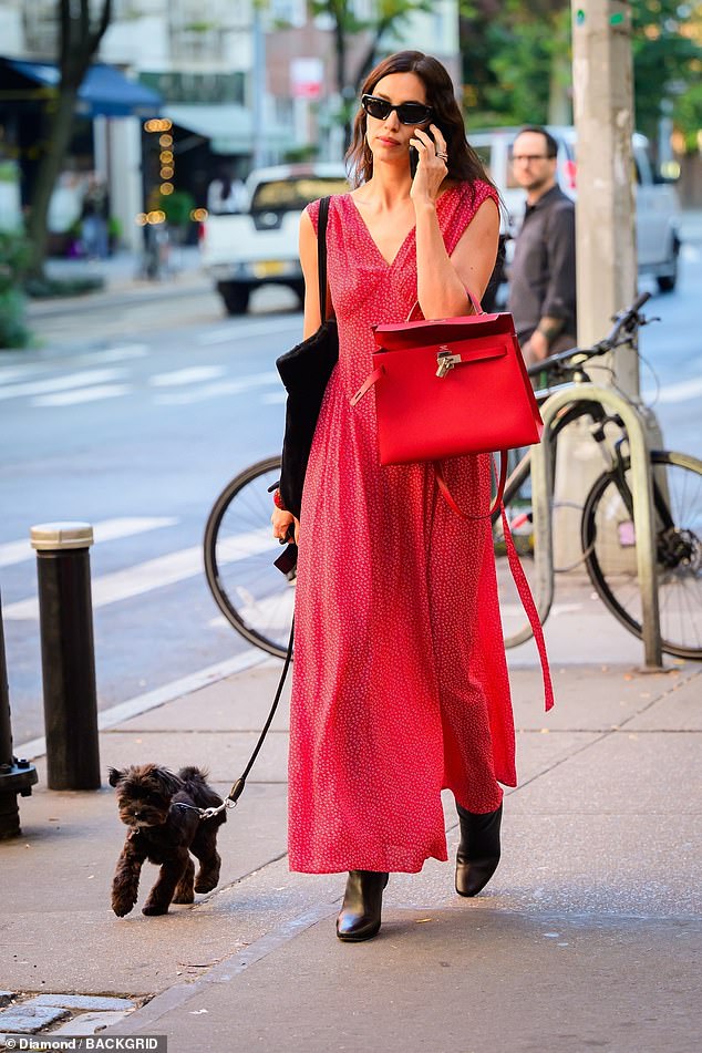 Irina was the epitome of effortless fashion in her flowy red dress, chunky boots, and a matching Hermes bag on her arm.