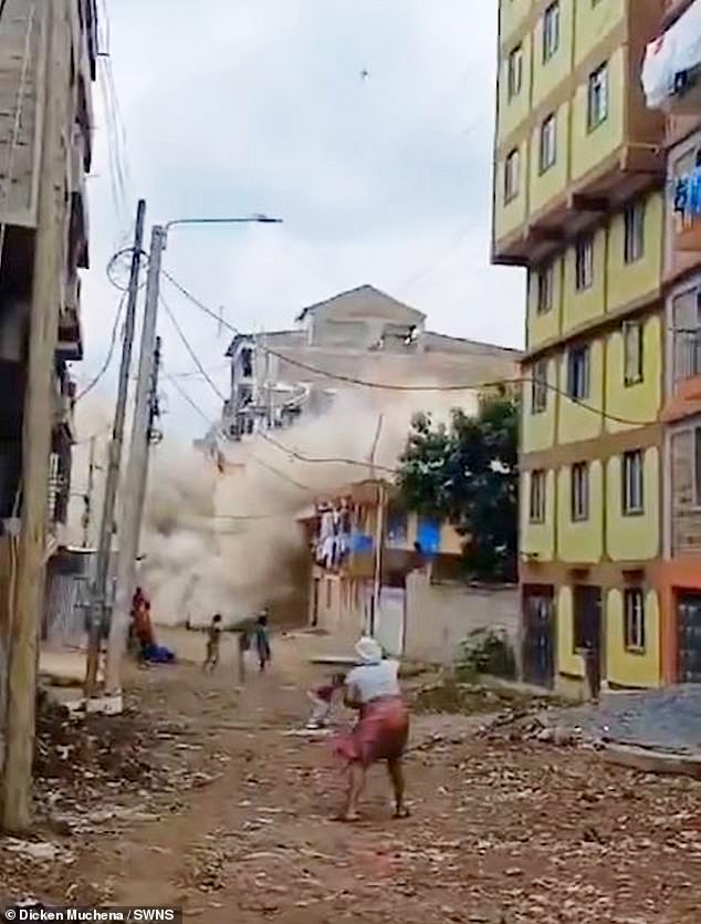 The tall building collapsed in a column of smoke and locals fled the scene.