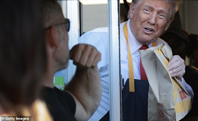 Trump was all smiles while working the self-service line during his visit to a McDonald's restaurant in Feasterville-Trevose, Pennsylvania, on October 20, 2024.