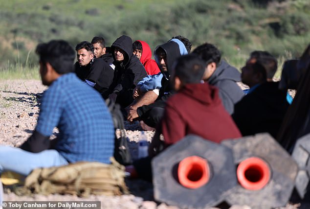 Migrants from Nepal, India and Bangladesh wait to be picked up by Border Patrol after crossing illegally into the United States.