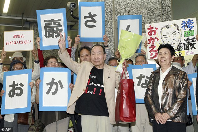 Iwao Hakamada is greeted by his fans upon his arrival in Hamamatsu, Shizuoka prefecture, central Japan, on May 27, 2014.